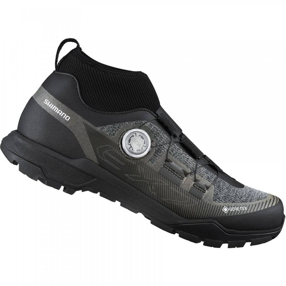 Shimano EX7 GORE-TEX waterproof mountain bike shoes showing black waterproof MTB footwear with Shimano branding and rugged soles.