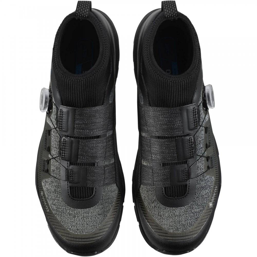 Shimano EX7 GORE-TEX waterproof mountain bike shoes with rugged footwear design for MTB riding.