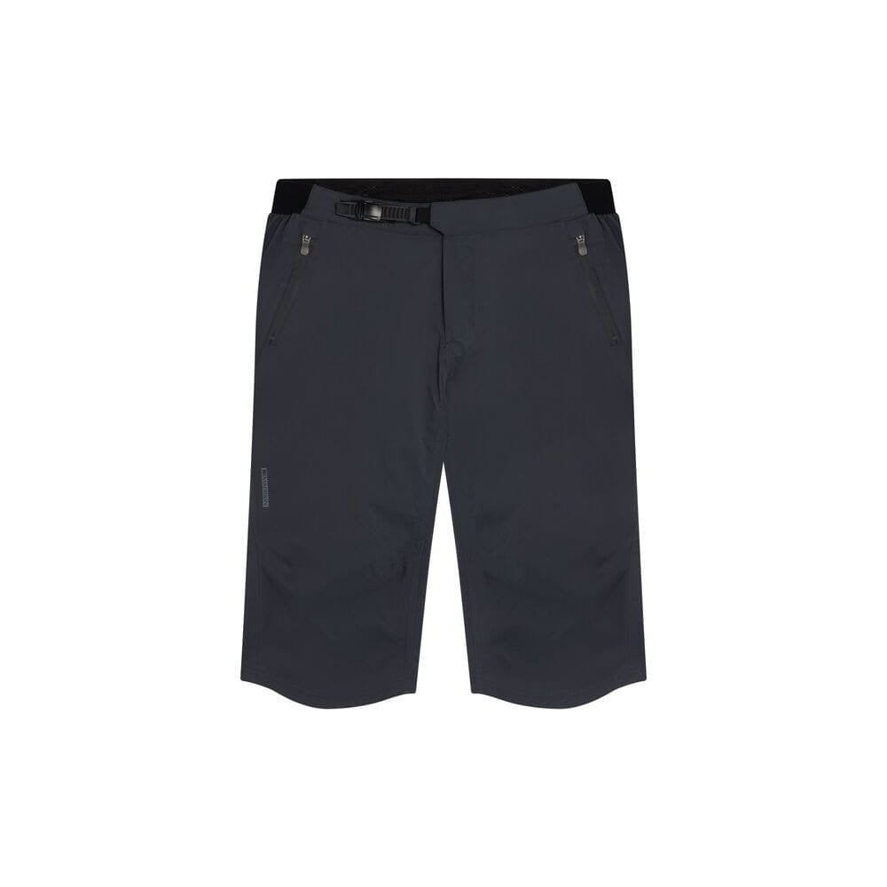 Madison DTE men's 3-layer waterproof cycling shorts with breathable fabric, shown in a natural outdoor riding setting.
