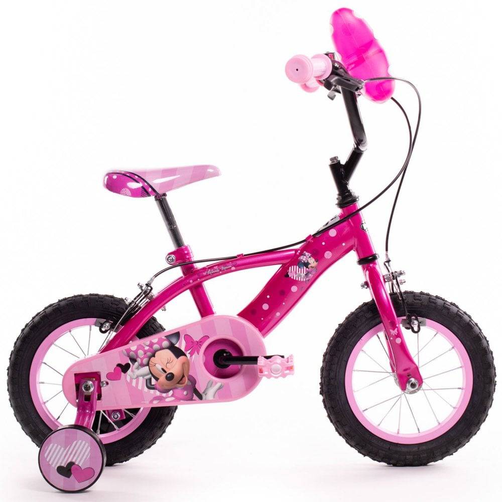 Huffy Disney Minnie 12-inch kids' beginner bike with training wheels in pink, featuring Minnie Mouse design and colorful details.
