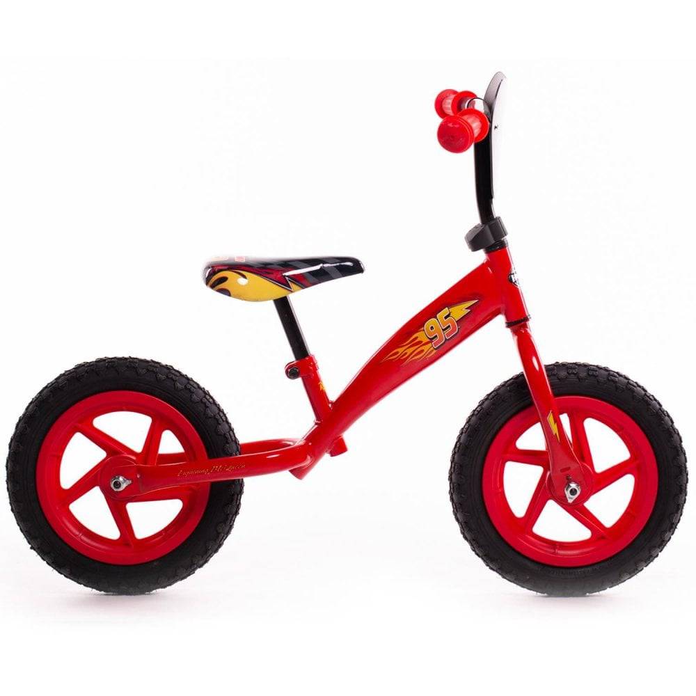 Huffy Disney Cars balance bike for kids featuring Lightning McQueen graphics, 12-inch red bike suitable for ages 2-5.