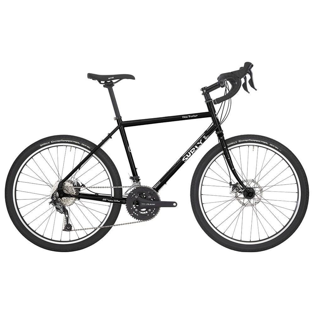Surly Disc Trucker 26-inch touring bike with disc brakes and sturdy touring frame, designed for long-distance cycling.