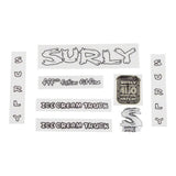 Surly bike decal kit with headbadges, frame decals, and spare components for customizing bicycle appearance.