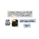 Surly M5 frame plugs with headbadge, bike frame spares and accessories, featuring black plugs and branded headbadge on a bicycle frame.