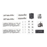 Surly 5 port hose and gear spares kit with headbadge for bike components, featuring hoses, fittings, and branding details.