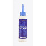 Morgan Blue Dry Wax bike chain lubricant in a workshop setting, showing the professional-grade, dirt-repellent formula bottle.