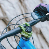 Granite STASH RT GPS computer mount for Garmin, Wahoo, Bryton devices, shown installed on a bicycle handlebar.