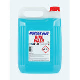Morgan Blue Bike Wash cleaner in a workshop setting, showing a container of gentle bike soap for cleaning and protecting bicycles.