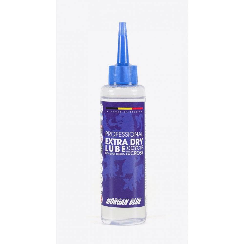 Morgan Blue Extra Dry Lube spray for MTB and cyclocross bike chains, shown in workshop setting.