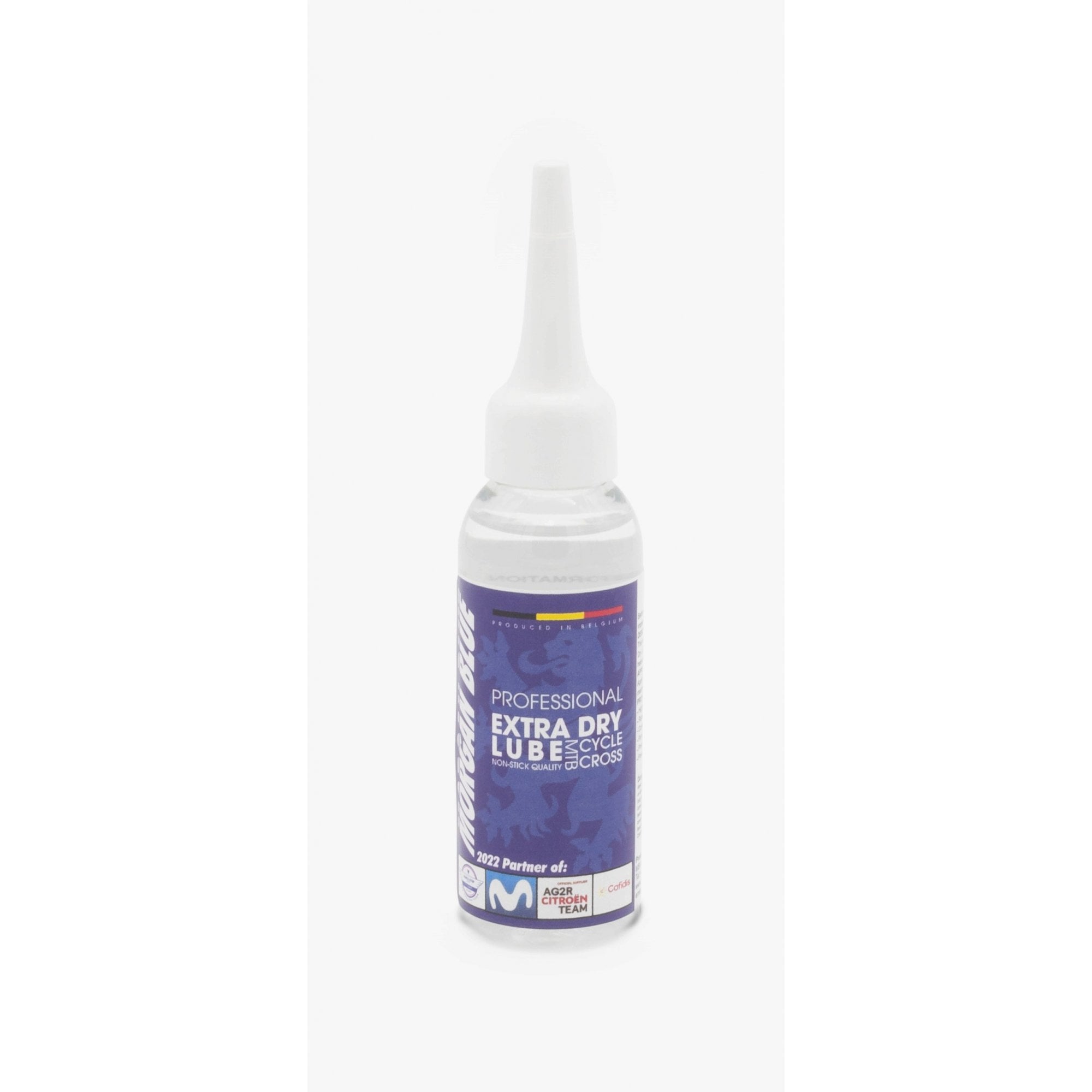 Morgan Blue Extra Dry Lube spray for MTB and cyclocross bike chains, shown in a workshop setting.