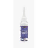 Morgan Blue Extra Dry Lube spray for MTB and cyclocross bike chains, shown in a workshop setting.