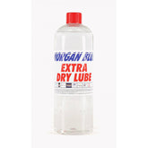 Morgan Blue Extra Dry Lube MTB and cyclocross bike chain lubrication spray shown in a workshop setting.