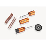 Granite workshop puncture repair tyre plug kit with orange plugs and hidden handlebar storage for bike tire repairs.