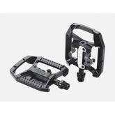 Black BBB BPD-61 DualChoice clipless and flat bicycle pedals with SPD cleats, showcasing the sleek design and pedal mechanism.