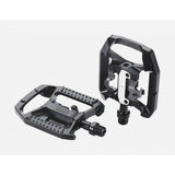 Black BBB BPD-61 DualChoice clipless and flat bicycle pedals with SPD cleats, showcasing the sleek design and pedal mechanism.