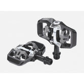 BBB BPD-71 TrailMount clipless MTB pedal with adjustable tension and SPD cleats, shown mounted on a mountain bike pedal platform.