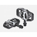 BBB BPD-71 TrailMount clipless MTB pedal with adjustable tension and SPD cleats, shown mounted on a mountain bike pedal platform.
