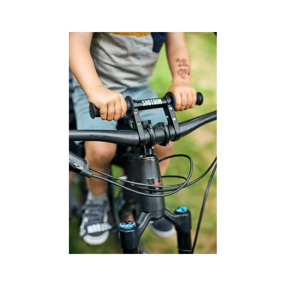 Kids Ride Shotgun black child bike seat and handlebars combo for kids, designed for safe and comfortable riding.