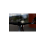 Knog Frog V3 rechargeable bike light set in denim blue with front and rear lights for cycling safety.
