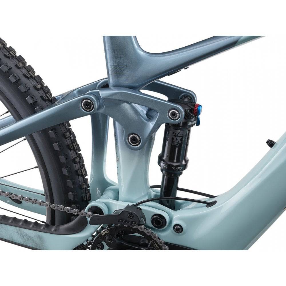 Liv Intrigue X Advanced E+ EL women’s electric mountain bike with SyncDrive Pro motor, black frame, and off-road tires.