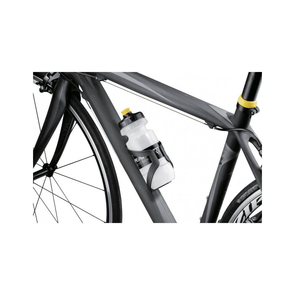 Topeak Shuttle Cage Black water bottle holder mounted on a bicycle frame, featuring durable construction and easy mounting system.
