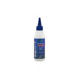 Squirt SEAL Tyre Sealant with BeadBlock for puncture protection on tubed and tubeless wheels, shown in a workshop setting.