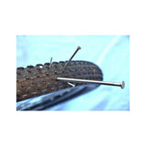 Squirt SEAL tyre sealant with BeadBlock for puncture protection on tubed and tubeless wheels, shown in workshop setting.