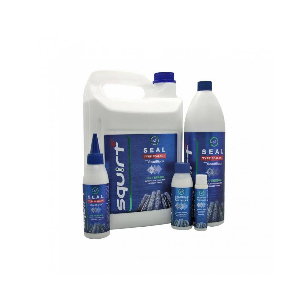 Squirt SEAL Tyre Sealant with BeadBlock for puncture protection on tubed and tubeless bicycle wheels, shown in workshop setting.