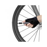 Topeak AirBooster Nano CO2 inflator for Presta and Schrader valves, compact black bicycle pump accessory.