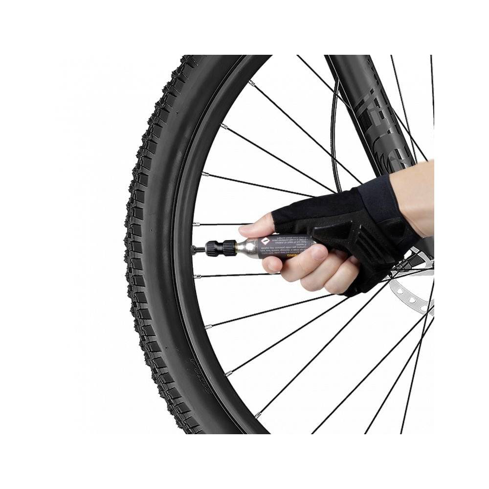 Topeak AirBooster Nano CO2 inflator for Presta and Schrader valves, compact black bike pump accessory shown.
