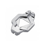 Topeak Duo Spoke Wrench tool for precise bike wheel spoke adjustments, shown in a workshop setting.