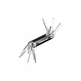 Topeak BB Hide n Tool Black compact MTB bottom bracket multi-tool with 7 functions, displayed on a workshop surface.