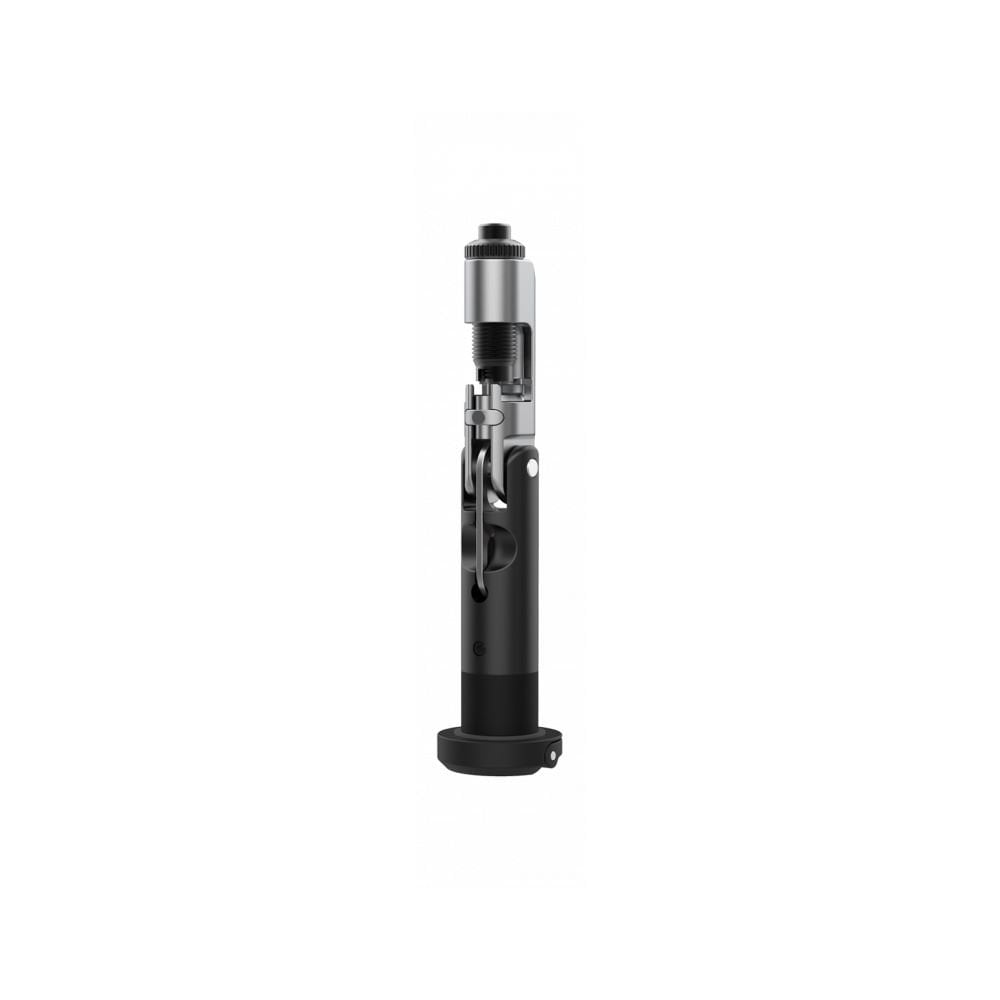 Topeak Plug n Chain 13s black compact MTB chain repair tool for 13-speed chains, shown in workshop setting.