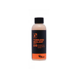 Orange Seal tubeless sealant refill for bike tires, designed to prevent punctures and enhance puncture protection.