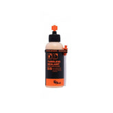 Orange Seal tubeless sealant with injector for fast puncture repair, designed for mountain bikes and road cycling components.