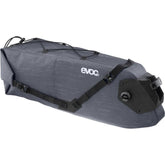 EVOC waterproof saddle bag with Boa closure, 12L capacity, attached to a road bike, designed for gravel and MTB cycling accessories.