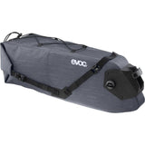 EVOC waterproof saddle bag with Boa closure, 12L capacity, attached to a road bike, designed for gravel and MTB cycling accessories.