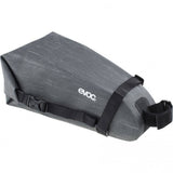 EVOC waterproof saddle bag for bike storage and touring, compact 4L seat pack with waterproof material and secure straps.