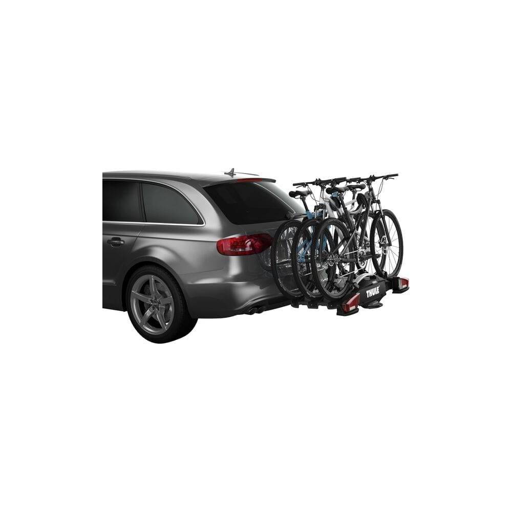 Thule VeloCompact 926021 3-bike towball carrier with 13-pin connector, shown attached to a vehicle for bike transport.