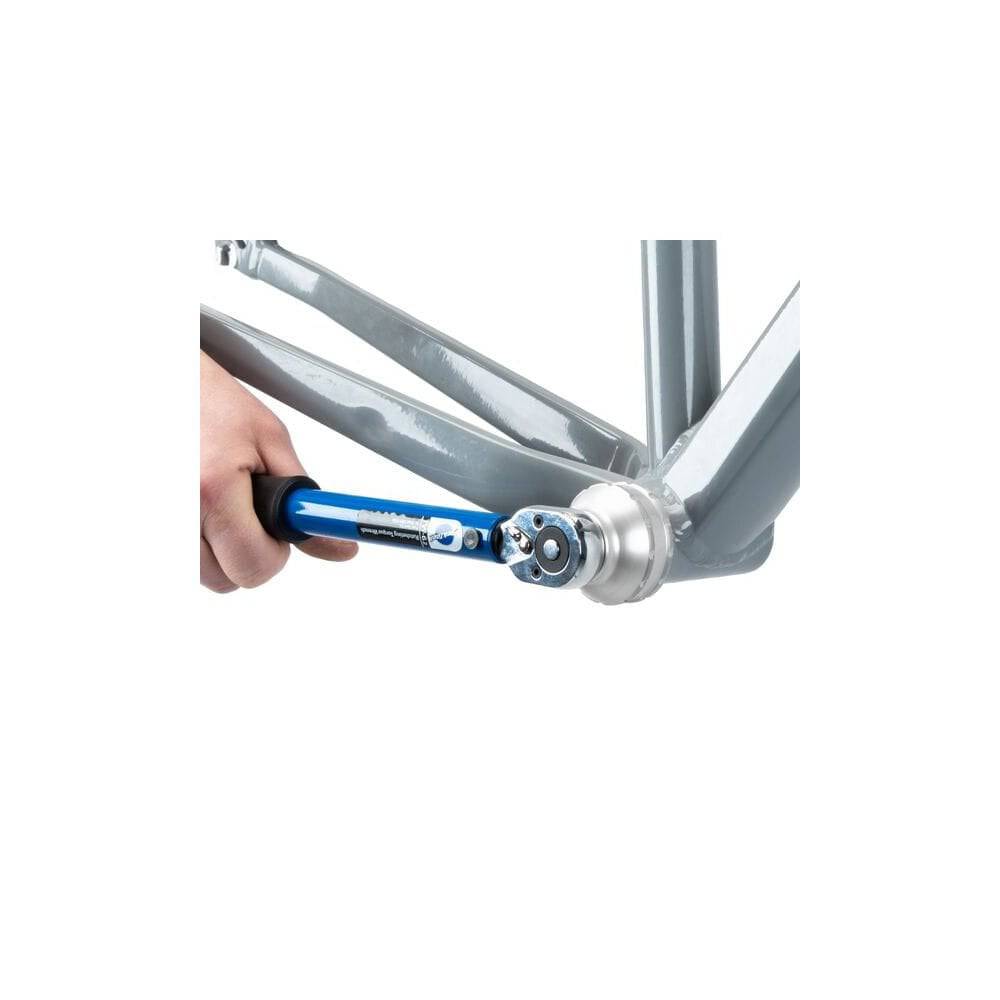 Park Tool BBT-79.3 12-Notch 46mm bottom bracket tool for threaded bottom brackets, shown on a workshop workbench.
