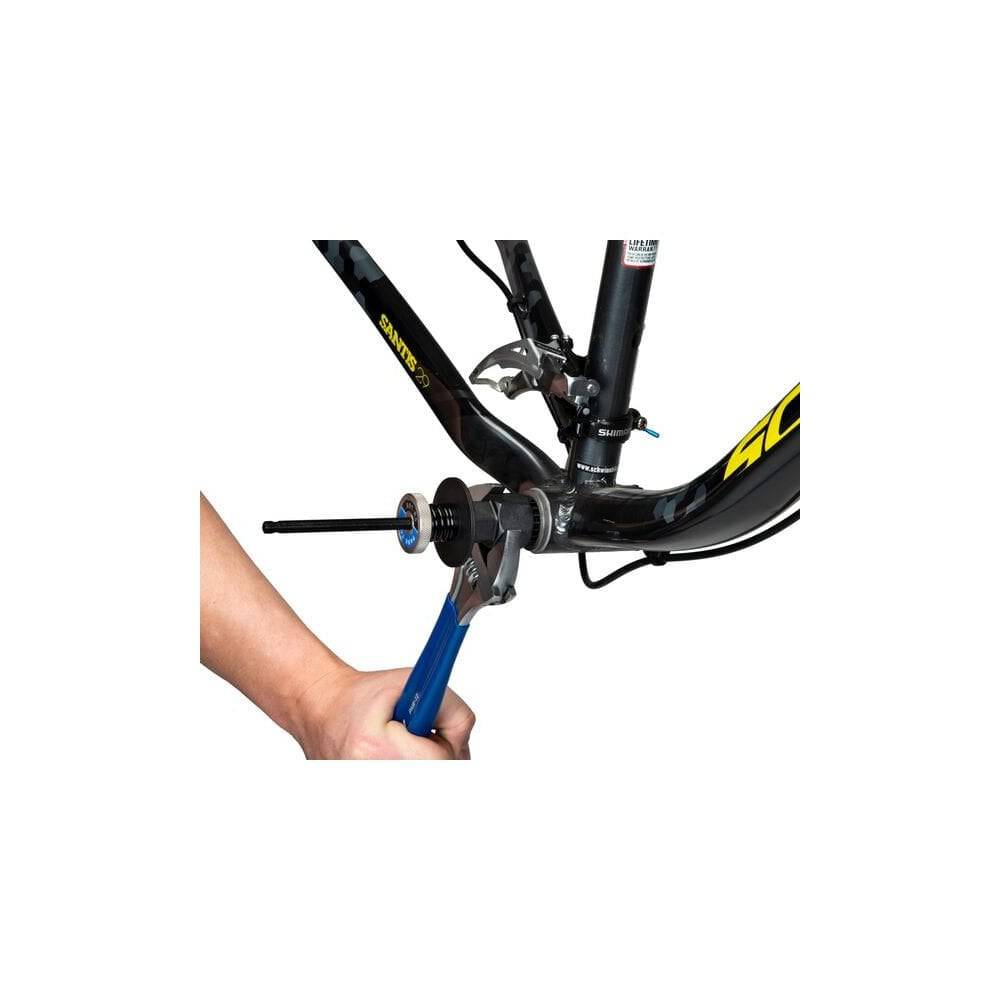 Park Tool BBT-RS bottom bracket tool retaining system shown in a workshop setting for secure engagement during bike maintenance.