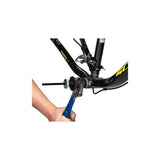 Park Tool BBT-RS bottom bracket tool retaining system shown in a workshop setting for secure engagement during bike maintenance.