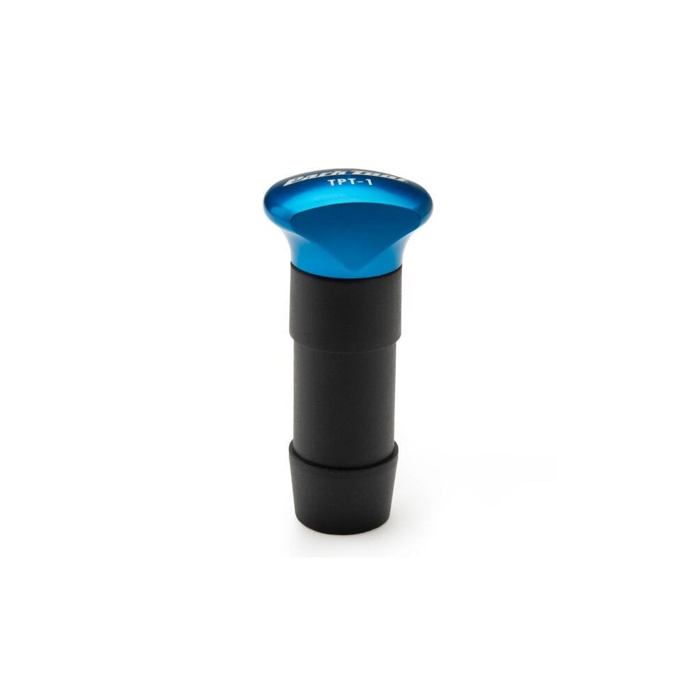 Park Tool TPT-1 tubeless tyre plug tool with five plugs for quick puncture repairs, shown in a workshop setting.