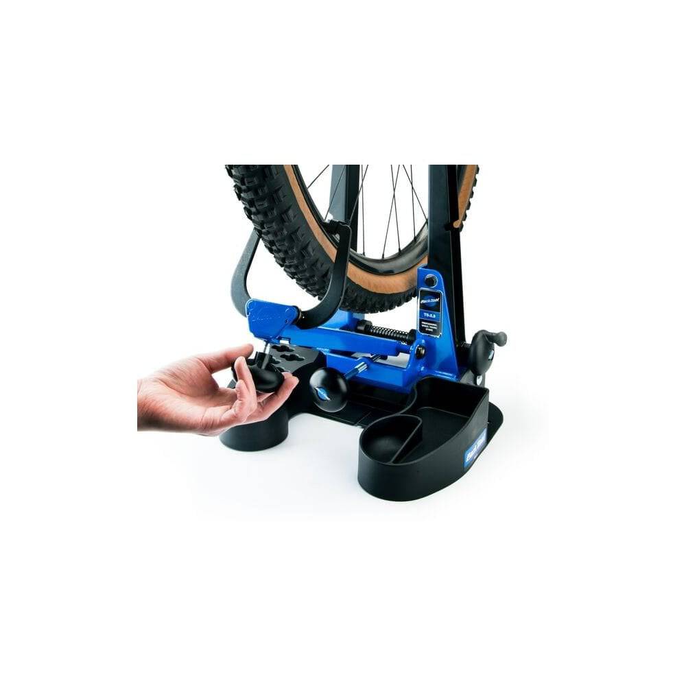 Park Tool TS-2.3 professional wheel truing stand for road, MTB, and BMX wheels, used in bike workshop settings.