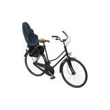 Thule Yepp 2 Maxi child seat rear rack mount for bike, providing safety and comfort for young passengers.