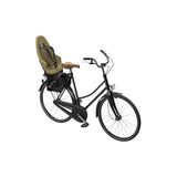 Thule Yepp 2 Maxi child bike seat rear rack mount accessory for bike safety and comfort, shown on a bicycle.