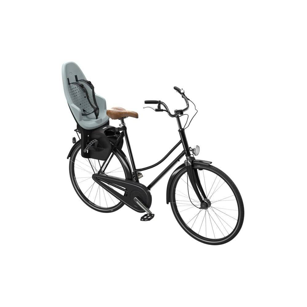 Thule Yepp 2 Maxi child seat rear rack mount for bike accessories, providing safety and comfort for young riders.