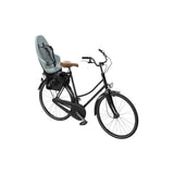 Thule Yepp 2 Maxi child seat rear rack mount for bike accessories, providing safety and comfort for young riders.