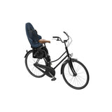Thule Yepp 2 Maxi child bike seat with safety harness, rear seat tube mount, durable accessories for secure riding.