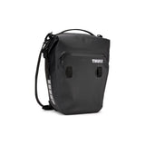 Pair of Thule Shield waterproof panniers with reflective panels, designed for touring and commuter bikes, mounted on bike racks.